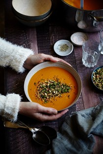 Curry carrot soup with toasted quinoa topping