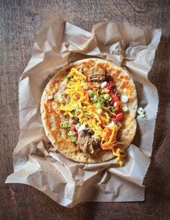 Curry goat with green papaya slaw