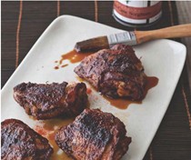 Curry-rubbed smoked chicken thighs with sorghum-chile glaze