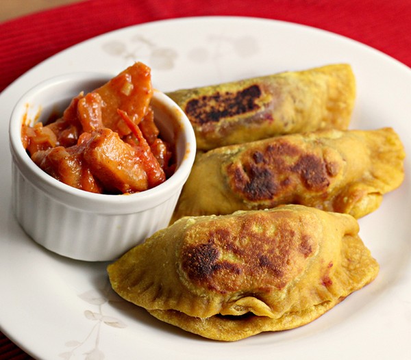 Curry-spiced sweet potato samosas with a persimmon-tomato marmalade