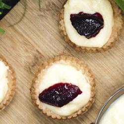 Custard and blackcurrant jam tarts