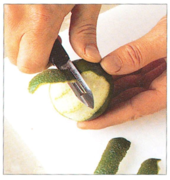 Cutting citrus fruit peel into julienne strips