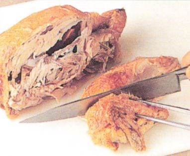 Cutting up a roasted bird