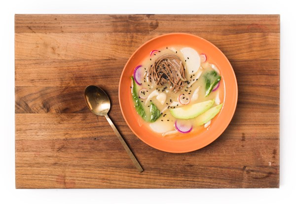 Daikon and mushroom miso soup with watermelon radish, udon noodles, and avocado