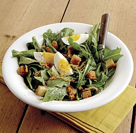 Dandelion salad with pancetta, eggs, and croutons