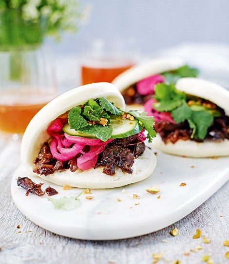 Dan's steamed buns with orange & pomegranate glazed lamb, quick-pickled red onion and pistachios