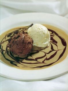 Dark and white chocolate mousses on a coffee sauce