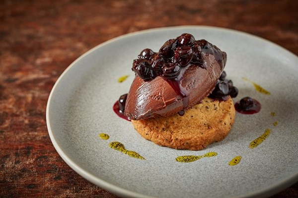 Dark chocolate and rapeseed ganache with shortbread and blackcurrants