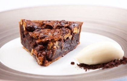 Dark chocolate and walnut tart and crème fraîche ice cream