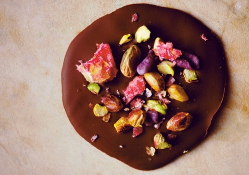 Dark chocolate discs with rose petals