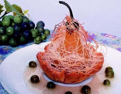 Date-stuffed saffron-poached pears with Chardonnay wine sauce