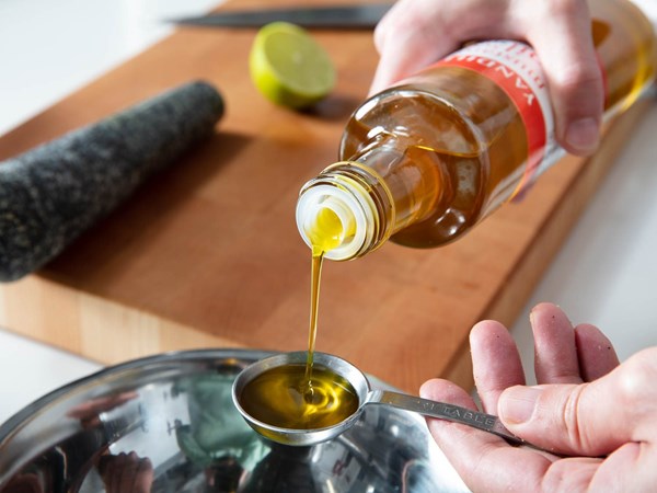Debittered olive oil or mustard oil