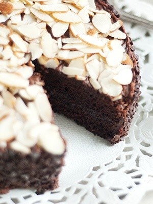 Decadent chocolate almond cake with sour cream icing