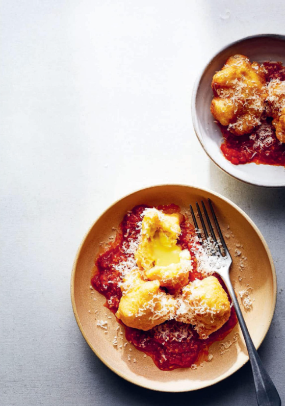 Deep-fried Camembert beignets with tomatoes
