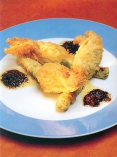 Deep-fried courgette flower parcels of sheep's cheese and pinenuts with olive tapenade