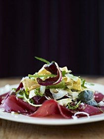 Delicate egg ribbons with bresaola, crispy fennel and spring leaves