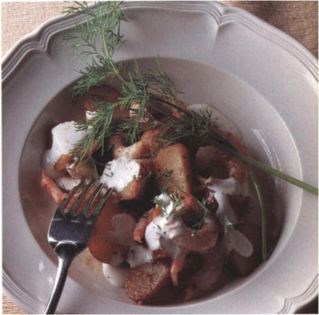 Delicately spiced potato and prawn salad with soured cream and fresh dill