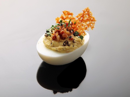 Deviled eggs carbonara (Crispy pancetta, pork fat, Parmesan crisps, and black pepper)