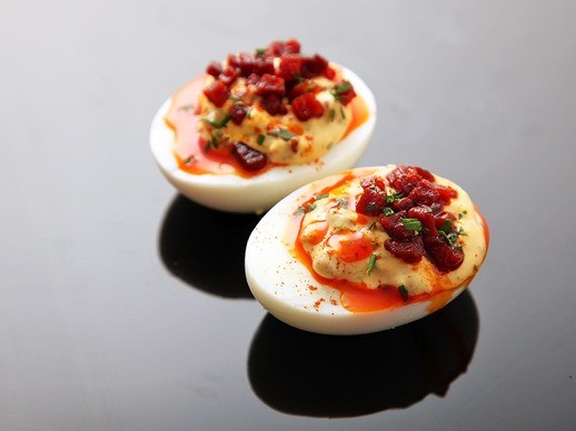 Deviled eggs with crispy chorizo, chorizo oil, and smoked paprika