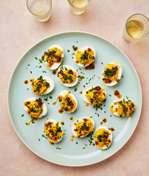 Devilled eggs with tarragon and poppy seed oil