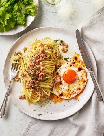 Dill butter prawn linguine with chilli crisp fried eggs
