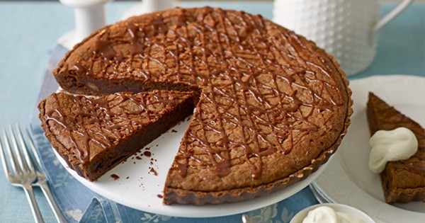 Double chocolate brownie tart with boozy cream