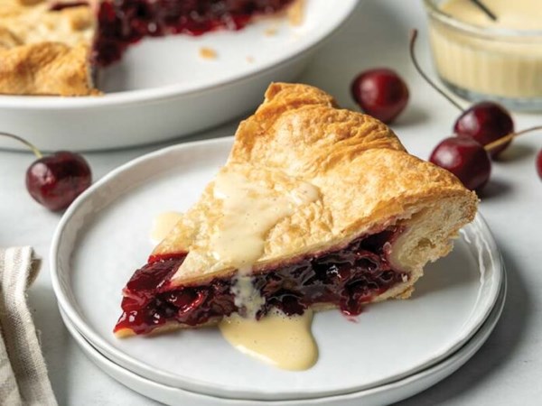 Double-crust cherry pie with crème Anglaise