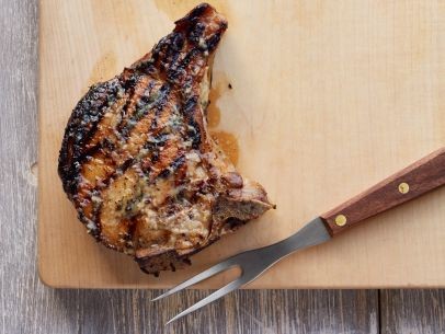 Double-cut pork chops with roasted garlic butter