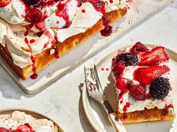 Double-decker meringue cake with summer berries