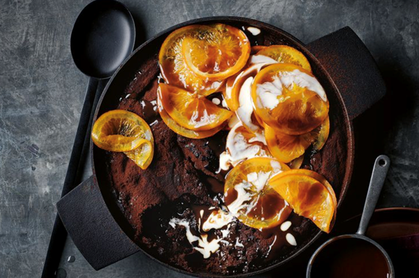 Double-saucing butterscotch chocolate orange pudding