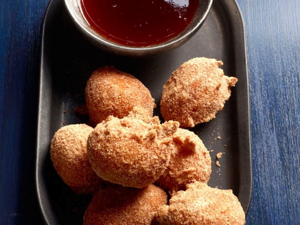 Doughnut holes with strawberry syrup