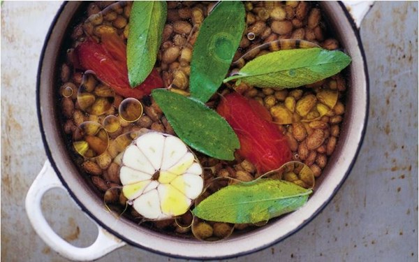 Dried beans cooked under oil and water with sage