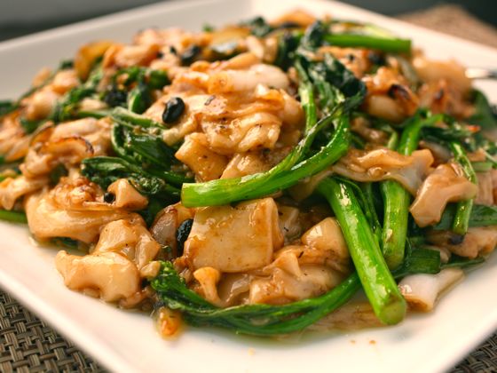 Dry-fried chow fun with Chinese broccoli