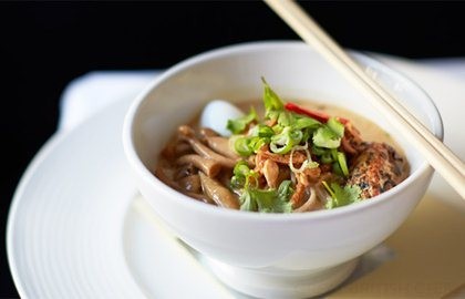 Duck and coconut laksa with grilled sweetcorn, soba noodles, squid and coriander