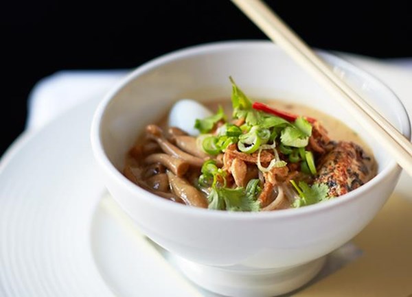 Duck and coconut laksa with grilled sweetcorn, soba noodles, squid and coriander
