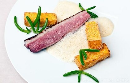 Duck breast with aromatic polenta fries and orange vinaigrette