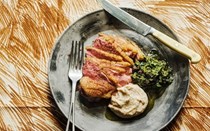 Duck breast with bean purée and olive herb salsa