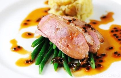 Duck breast with passion fruit sauce and crushed new potatoes