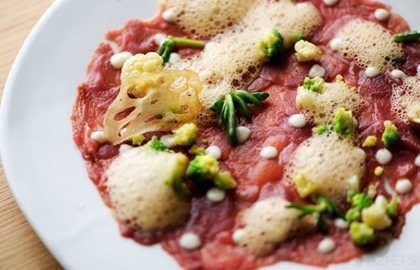Duck carpaccio with sea urchin foam, Romanesco cauliflower and lotus root crisp