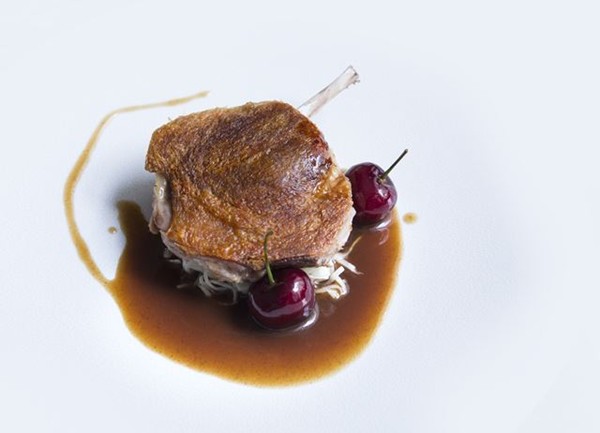 Duck leg with celeriac choucroute, bulgur wheat and cherries