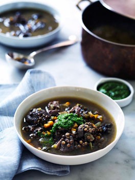 Duck, lentil and snail soup with garlic and parsley oil