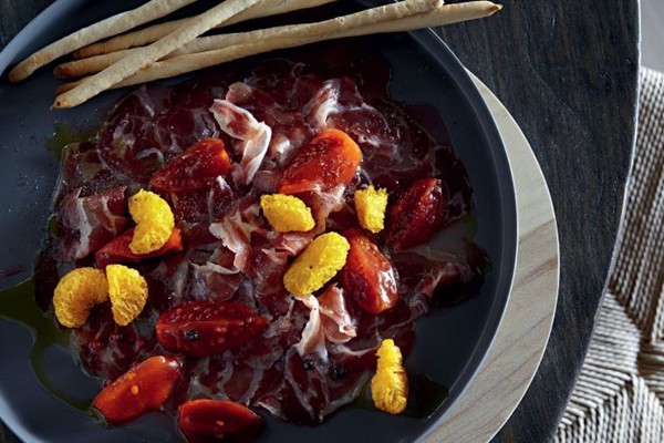 Duck prosciutto with pickled tamarillo and grissini