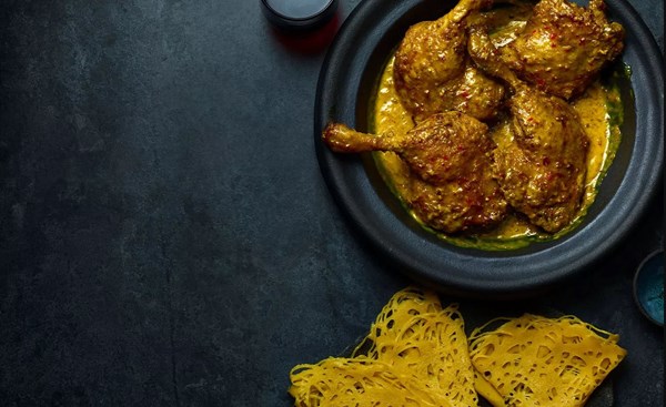 Duck rendang with roti jala