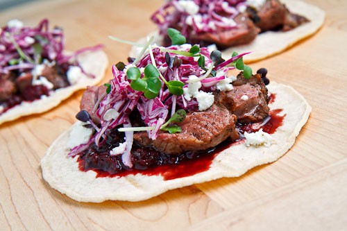 Duck tacos with chipotle cherry salsa and crumbled goat cheese