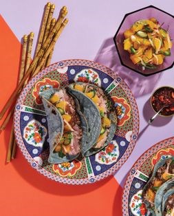 Duck tacos with orange ginger radish salsa and chili crisp