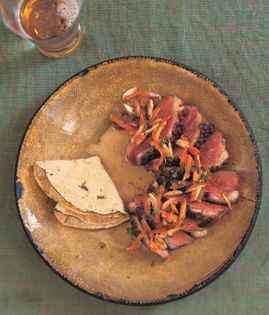 Duck with chihuacle negro sauce, raisins, and almonds