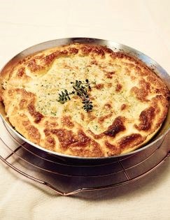 Dutch baby with nettle cheese & steamed leeks