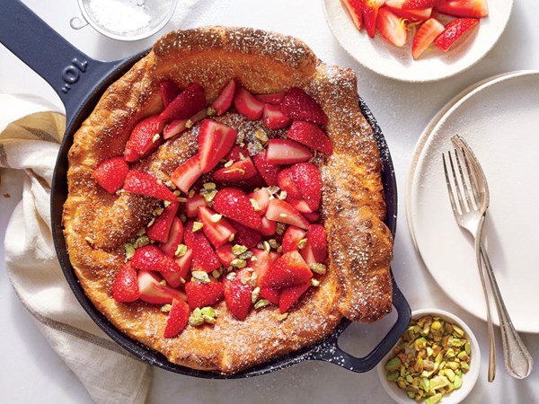 Dutch baby with strawberries and pistachios
