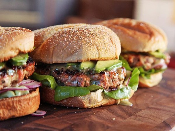 Easy salmon burgers with dill honey-mustard, horseradish, and avocado
