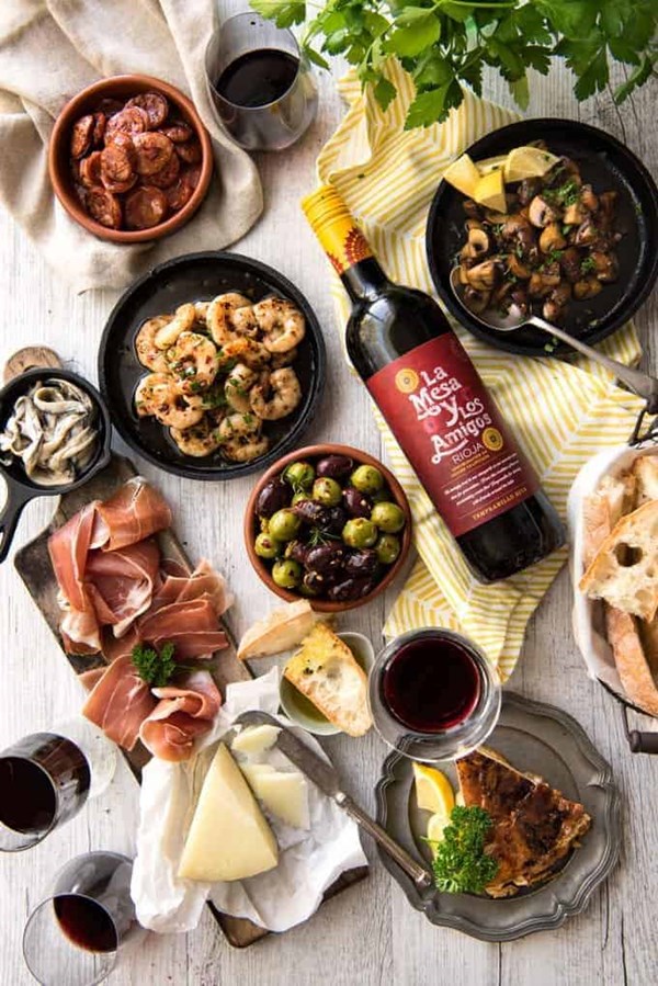 Easy Spanish tapas [garlic prawns, garlic mushrooms, chorizo, marinated olives, Spanish antipasto]